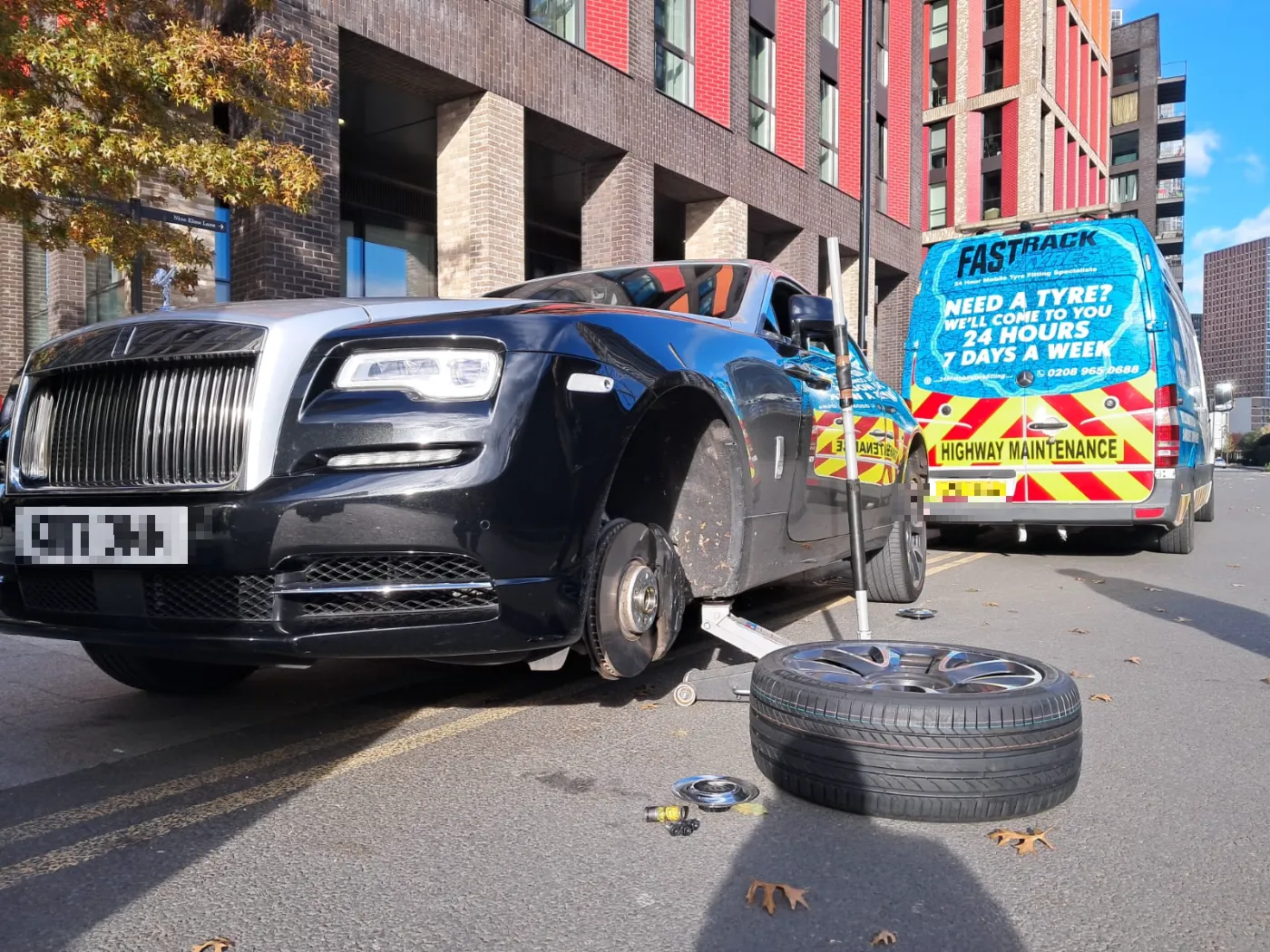 Rolls-Royce Wraith with the front wheel off at Nine Elms for a mobile tyre fitting